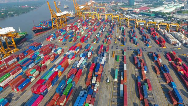 istock Logistics and transportation of Container Cargo ship and Cargo working crane bridge in shipyard 951789506