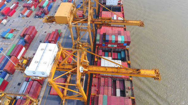 istock Logistics and transportation of Container Cargo ship and Cargo working crane bridge in shipyard 951789524