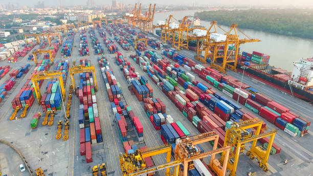 istock Logistics and transportation of Container Cargo ship and Cargo working crane bridge in shipyard 951789720