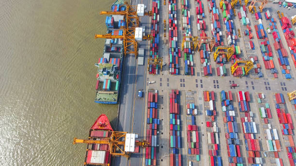 istock Logistics and transportation of Container Cargo ship and Cargo working crane bridge in shipyard 951789766