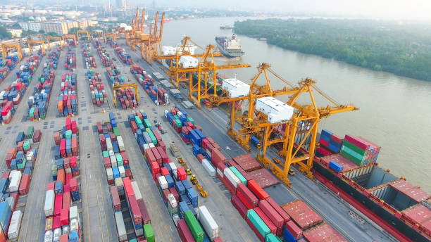 istock Logistics and transportation of Container Cargo ship and Cargo working crane bridge in shipyard 951789812