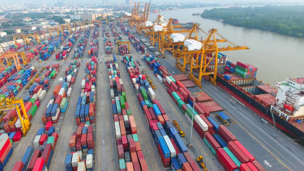 istock Logistics and transportation of Container Cargo ship and Cargo working crane bridge in shipyard 951790032