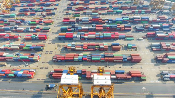 istock Logistics and transportation of Container Cargo ship and Cargo working crane bridge in shipyard 951790054