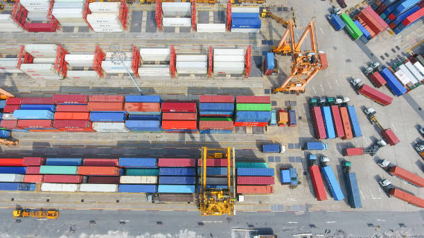 istock Logistics and transportation of Container Cargo ship and Cargo working crane bridge in shipyard 951790112