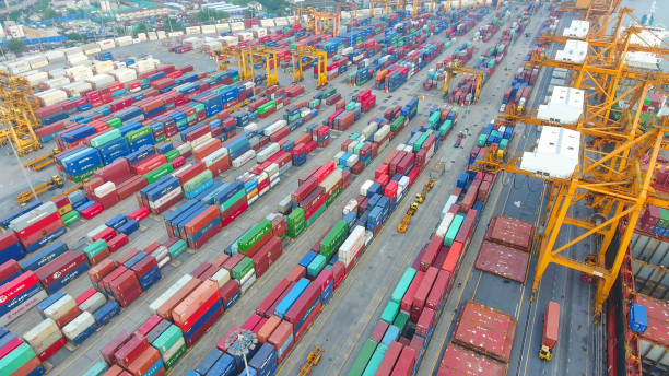 istock Logistics and transportation of Container Cargo ship and Cargo working crane bridge in shipyard 951790152