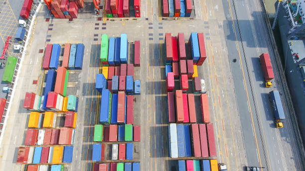 istock Logistics and transportation of Container Cargo ship and Cargo working crane bridge in shipyard 951790258