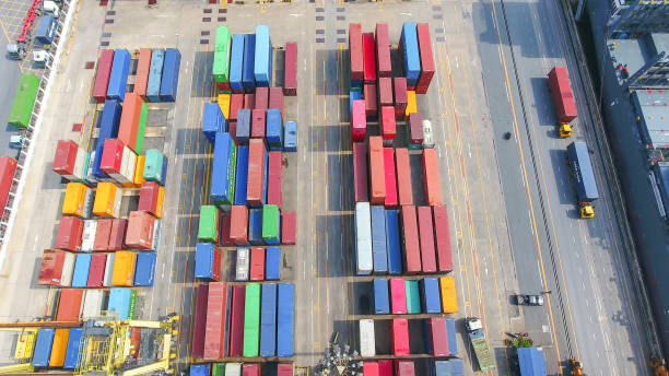 istock Logistics and transportation of Container Cargo ship and Cargo working crane bridge in shipyard 951790270