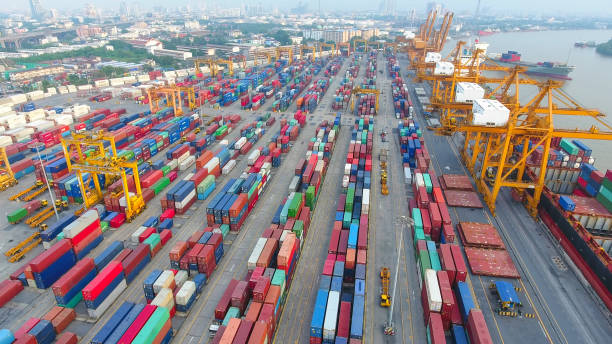 istock Logistics and transportation of Container Cargo ship and Cargo working crane bridge in shipyard 951790298