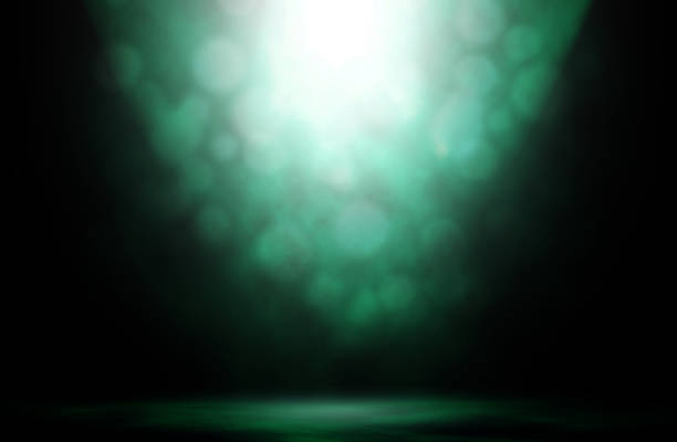 istock Green spotlight bokeh stage smoke night studio background. 951795842