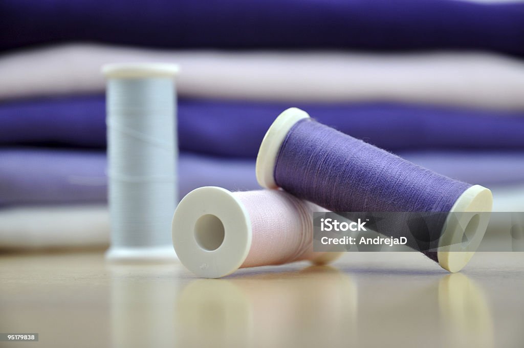 Spools and a Pile of Clothes  Blue Stock Photo