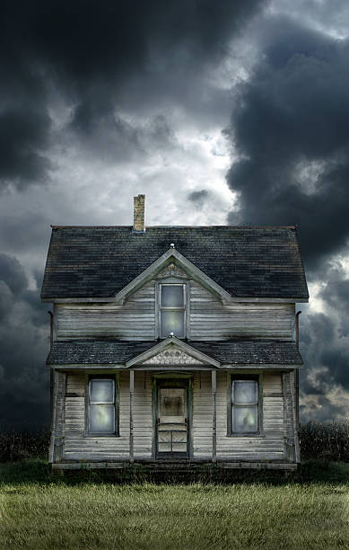 old farmhouse stormy sky - haunted house stok fotoğraflar ve resimler