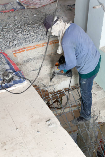 istock Builder destroys 
cement stairs with jackhammer 951806698