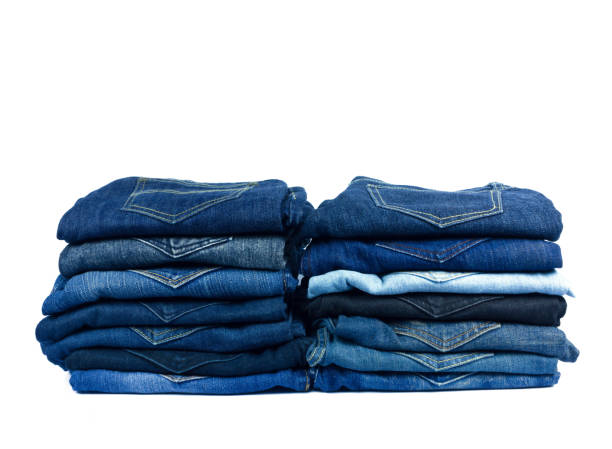istock jeans stacked isolated on white background. 951812540