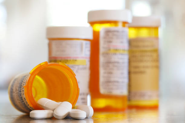 istock Open Prescription Medication Bottle On Countertop 951812898