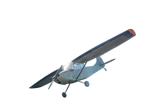 Small propeller airplane approaching the Quebec city airport during autumn day.