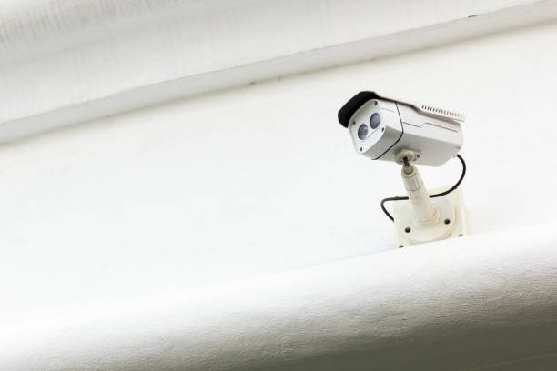 istock The CCTV Security Camera operating in the white terrace background. 951820408