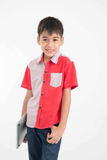 istock Portrait of little mix boy take a notebook tablet on white background 951820570