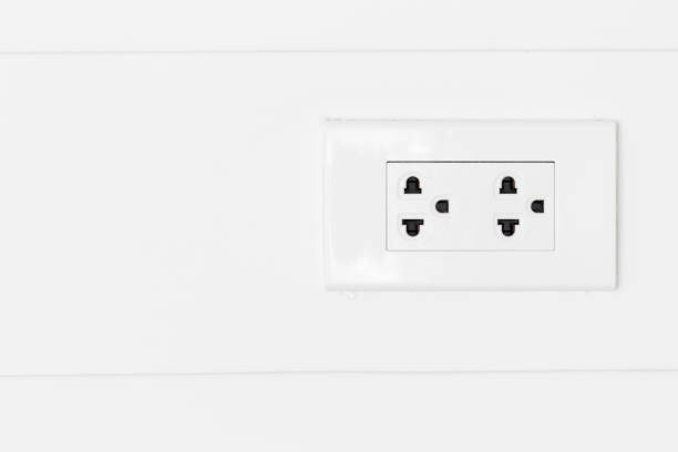 istock White plugs on white wood wall. 951823828