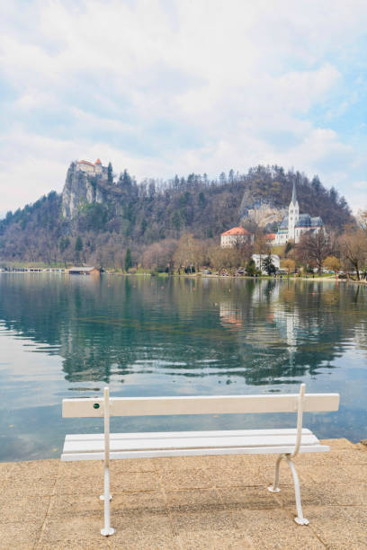 istock Landscape Lake Bled, Slovenia, Europe. Empty Park bench backgrounds. 951828516
