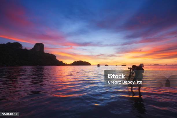 Photographer Taking Photo Of Sunrise At East Railay Bay Beach Krabi Thailand Stock Photo - Download Image Now