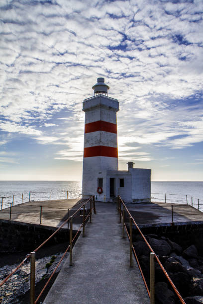 istock Bridge leading to the lighthouse. Iceland 951839502