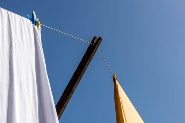 istock white sheet hanging from a washing line in summer 951840130