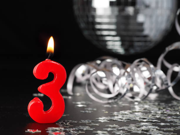 Red candles showing Nr. 3 stock photo