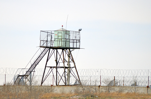 Prison fence and guard tower. Russia. Siberia