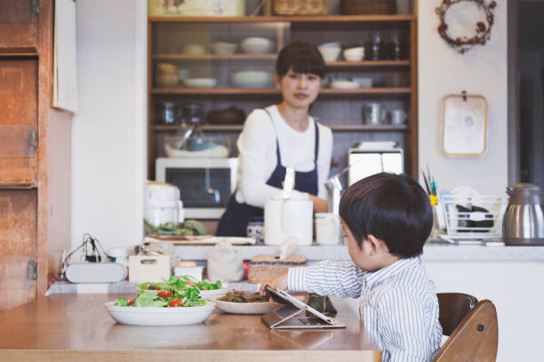 istock Mother and son in the dining kitchen at home 951845870