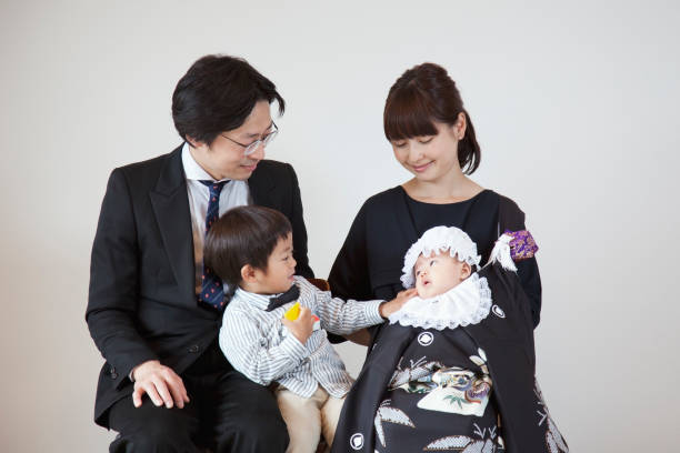 Portrait of Japanese family Memorial portrait of Japanese family to celebrate the birth of their new born baby. kimono photos stock pictures, royalty-free photos & images