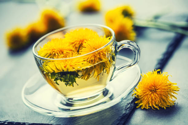 istock Cup of dandelion tea on slate board 951846042