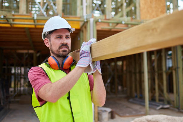istock Confident male construction worker carrying wood 951847590