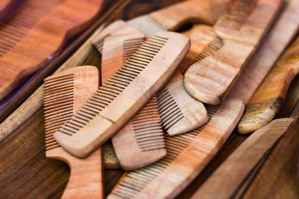 istock wooden combs on a wooden table. Vintage cosmetic accessory 951856184