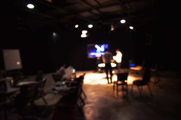 istock blurred image of people production team shooting some movie or setting education content for production for tv commercial in the culinary studio with studio equipment and video light stands and crew. 951856264