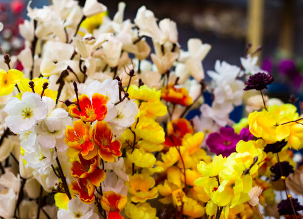 istock plastic flowers yellow white and orange for decoration 951856478