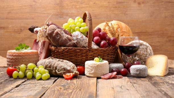 wicker basket with cheese and charcuterie