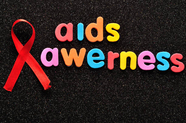 istock The words aids awareness with a red awareness ribbon 951856966