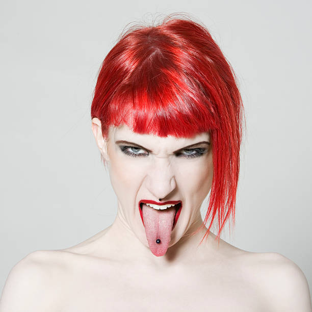 Sticking Out Tongue redhead girl  punk person photos stock pictures, royalty-free photos & images