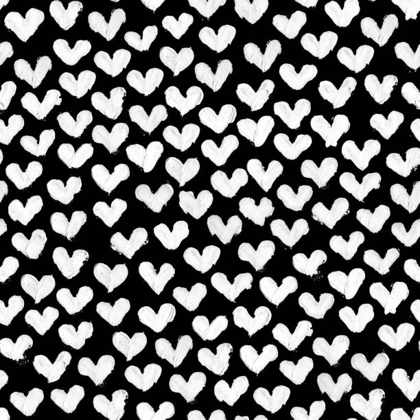 White hearts painted by thick paint on black surface - original high detailed seamless pattern background