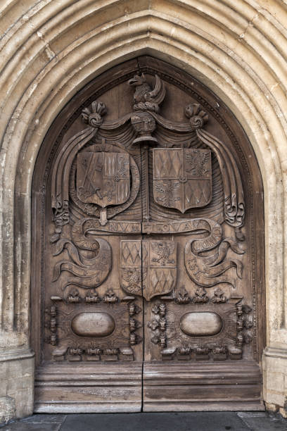 istock Old wooden door with carving, Bath, UK 951860360