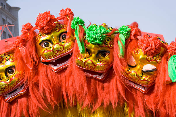 Colorful Chinese lion dancing and moving in the streets stock photo