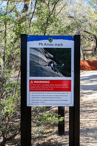 Wineglass Bay, Tasmania, Australia: March 29, 2018: General warning sign in Freycinet National Park erected by Tasmania Parks and Wildlife Service with information about the hazards on the Mount Amos Track.