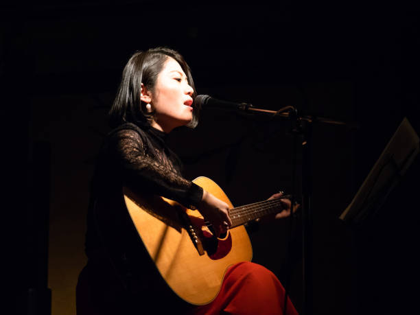 Asian musician performing on stage