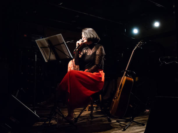 Asian musician performing on stage