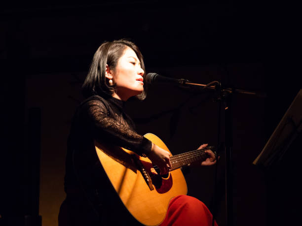 istock Asian musician performing on stage 951864196