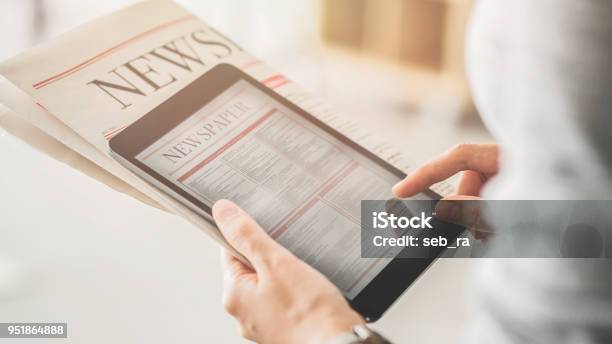 Person Holding And Reading News From Tablet Stock Photo - Download Image Now - Newspaper, The Media, Reading