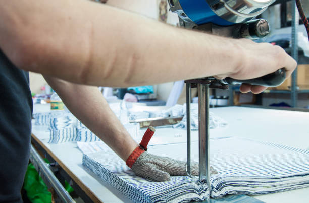 istock Worker using a machine in factory with iron glove 951866264