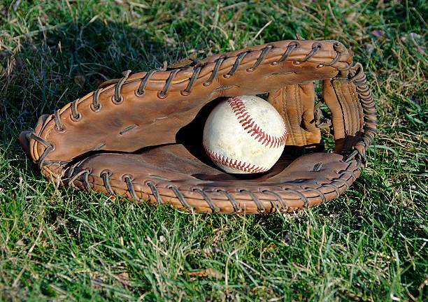 istock Baseball Glove and Ball in the Grass 95186925