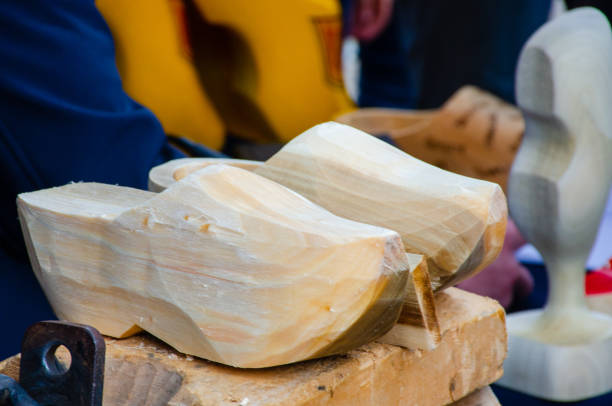 istock Traditional wooden clogs being carved 951870484