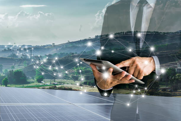 Solar Cells.Businessmen calculate investment. Solar Cells,electricity distribution, high power poles,Businessmen calculate investment,finances,renewable energy,men wear a White shirt,Suits,work with a computer. Internet, modern. sun exposure stock pictures, royalty-free photos & images